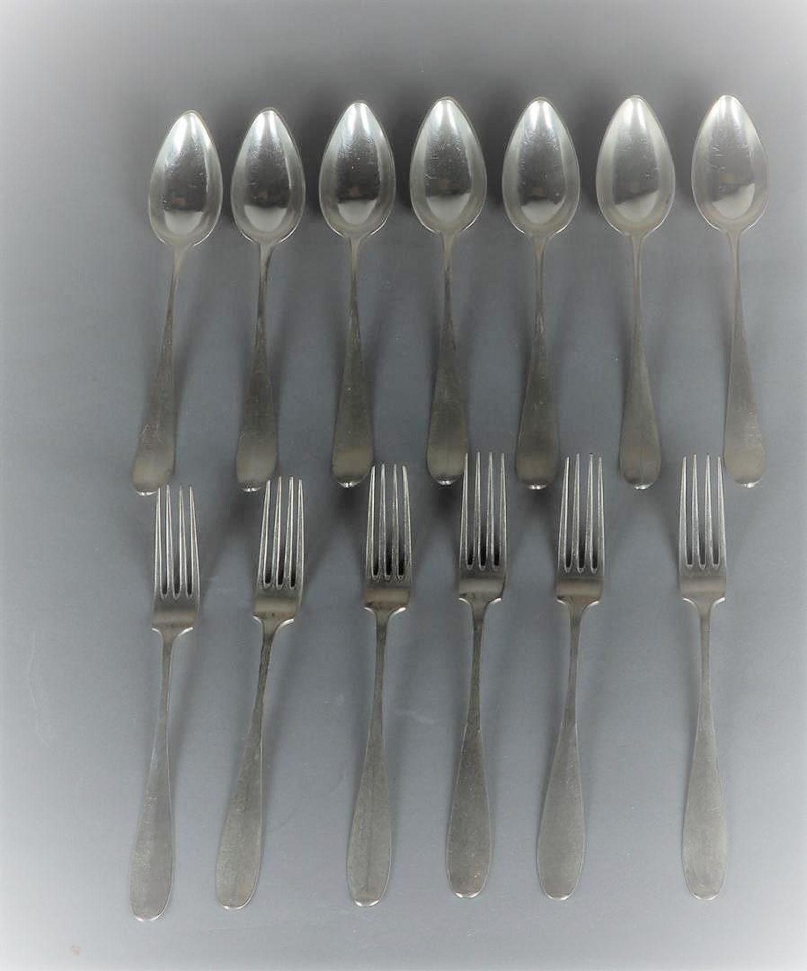 A silver cutlery part consisting of 6 spoons and 6 forks. 672 grams.