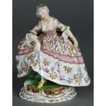 A porcelain figurine depicting a lady-in-waiting making a curtsy. Sèvre, first half of the 20th cent