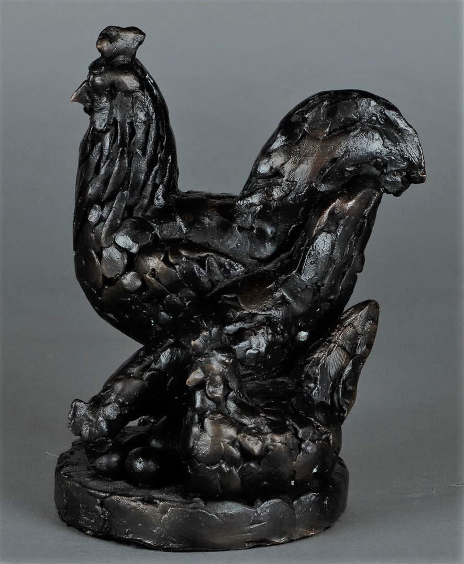 A dark patinated bronze group of chickens. 20th century.