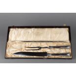 A meat cutting set with silver handle, marked 800.