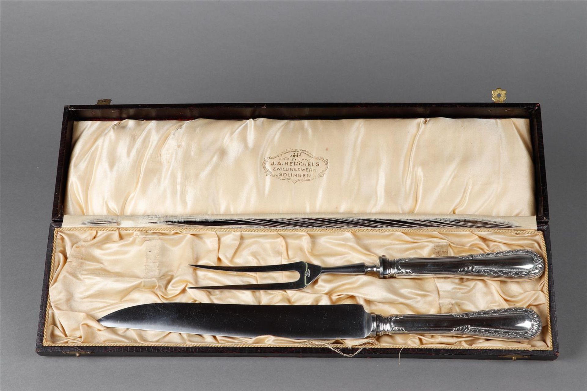 A meat cutting set with silver handle, marked 800.