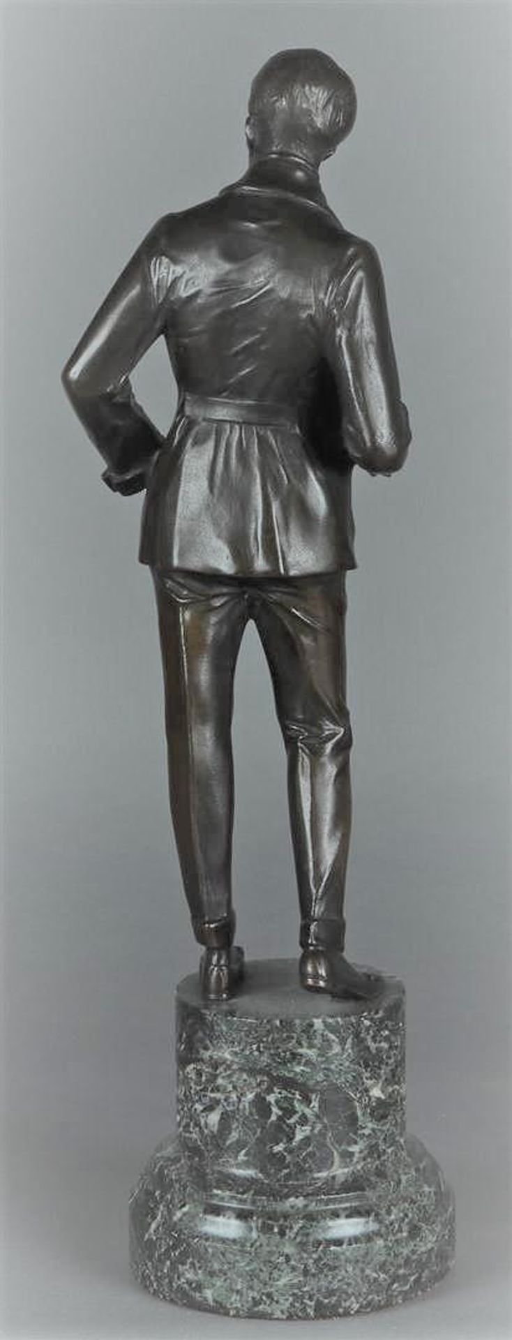 A bronze sculpture depicting a gentleman in evening jacket mounted on a green marble base. 20th cent - Image 2 of 2