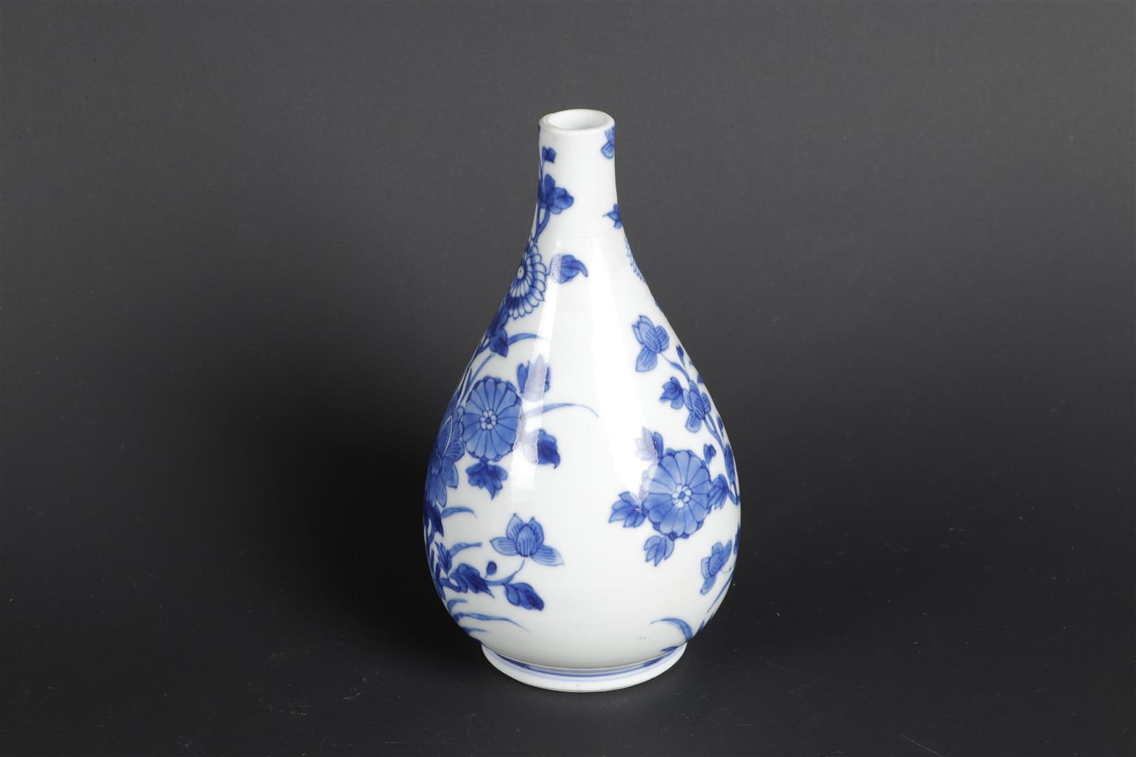 A porcelain belly vase with rich flower-on-rock decor on the front and back. China, Kangxi. - Image 2 of 5