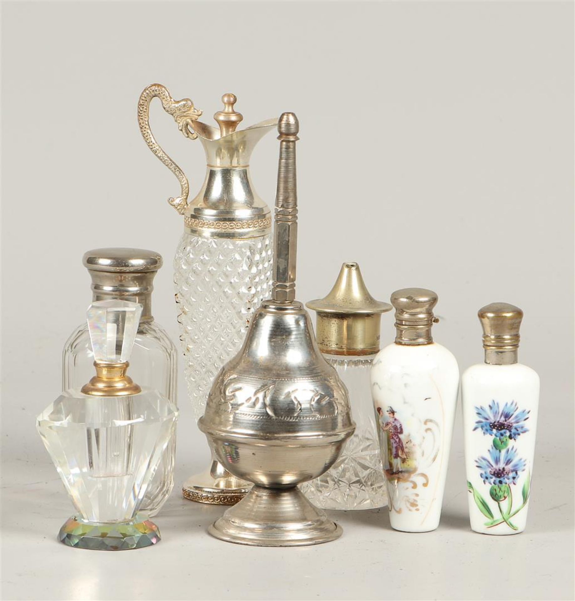 A lot consisting of, among other things, stopper bottles and a cut glass carafe.