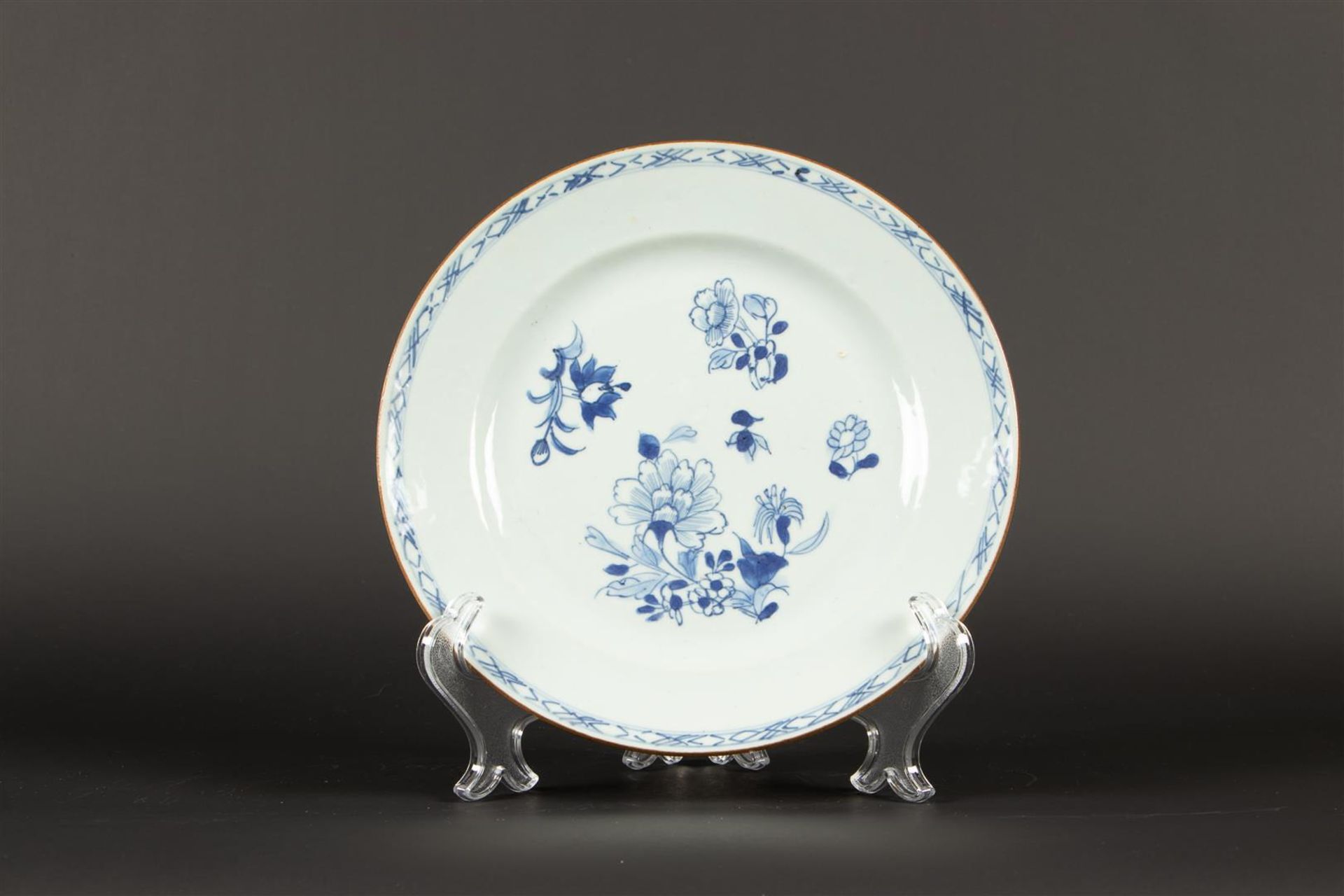 A porcelain plate with blossom branch decor. China, Qianglong.