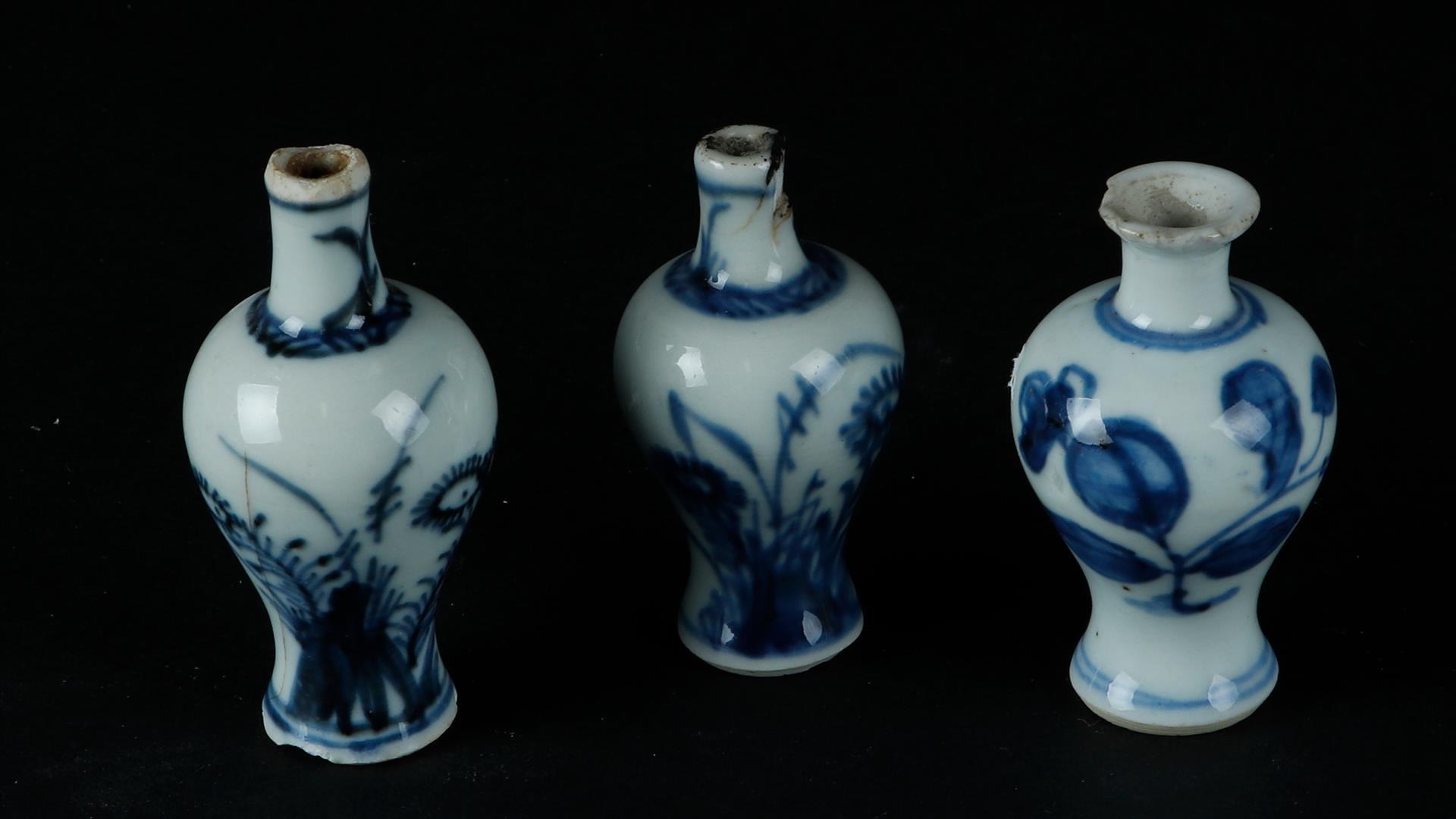 Three small porcelain shoulder vases, all with floral decoration. China, Qianlong.