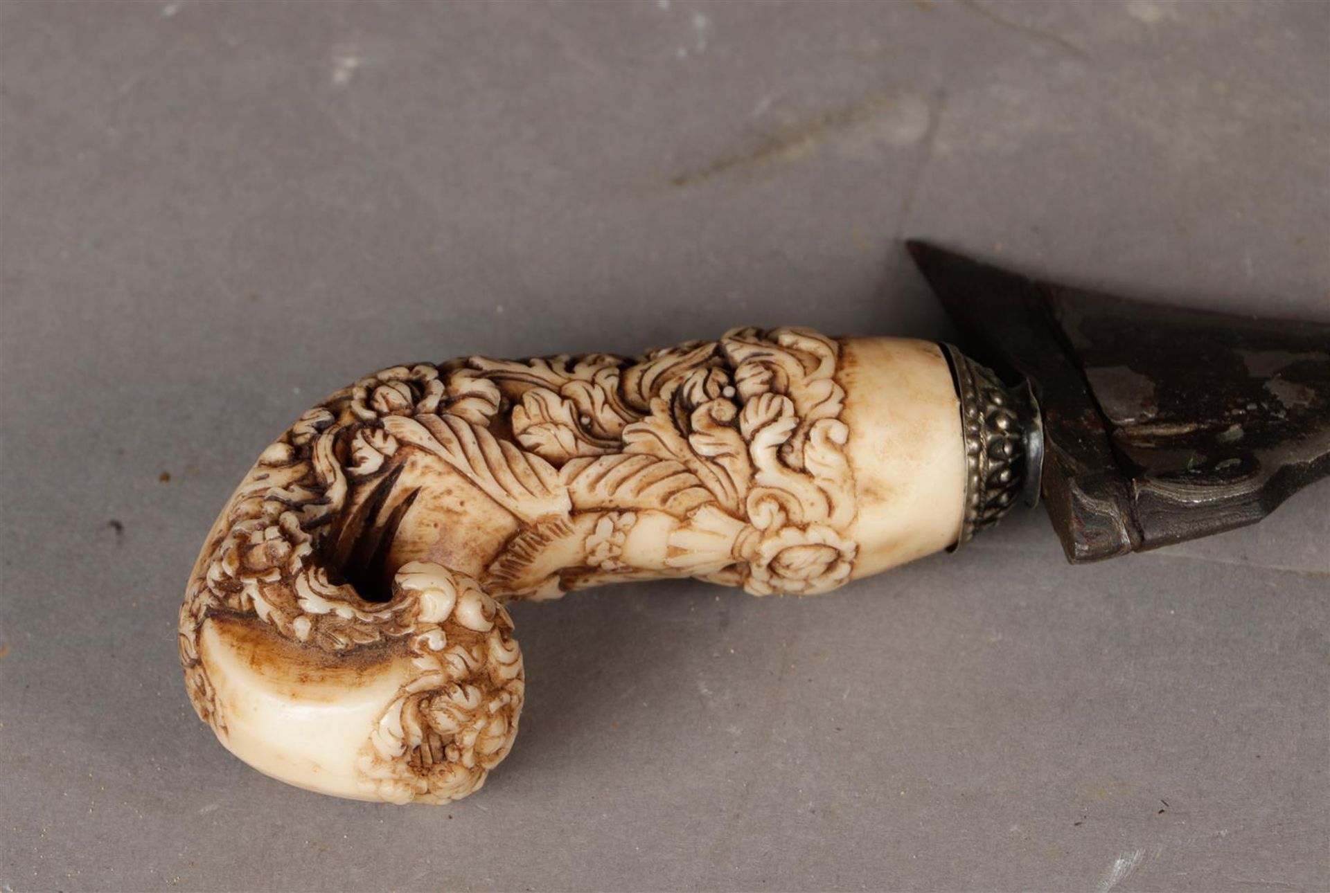 A kris with richly carved bone handle and a straight damask forged blade. Indonesia, 19th century or - Image 2 of 3