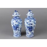 A set of two porcelain lidded vases decorated with dragons, marked Kangxi. China, 19th century.