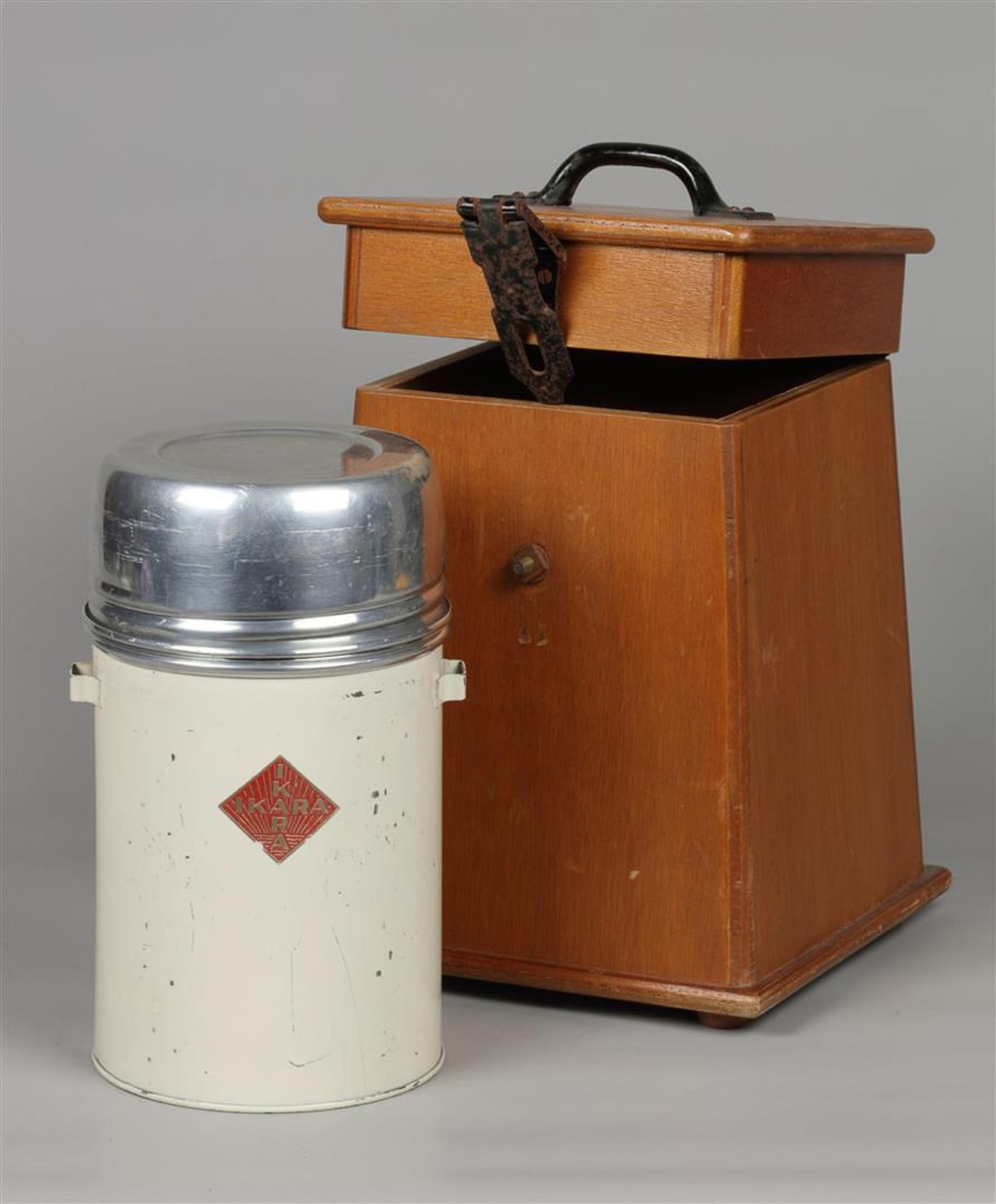 A vintage "Ikara" thermos in wooden case.