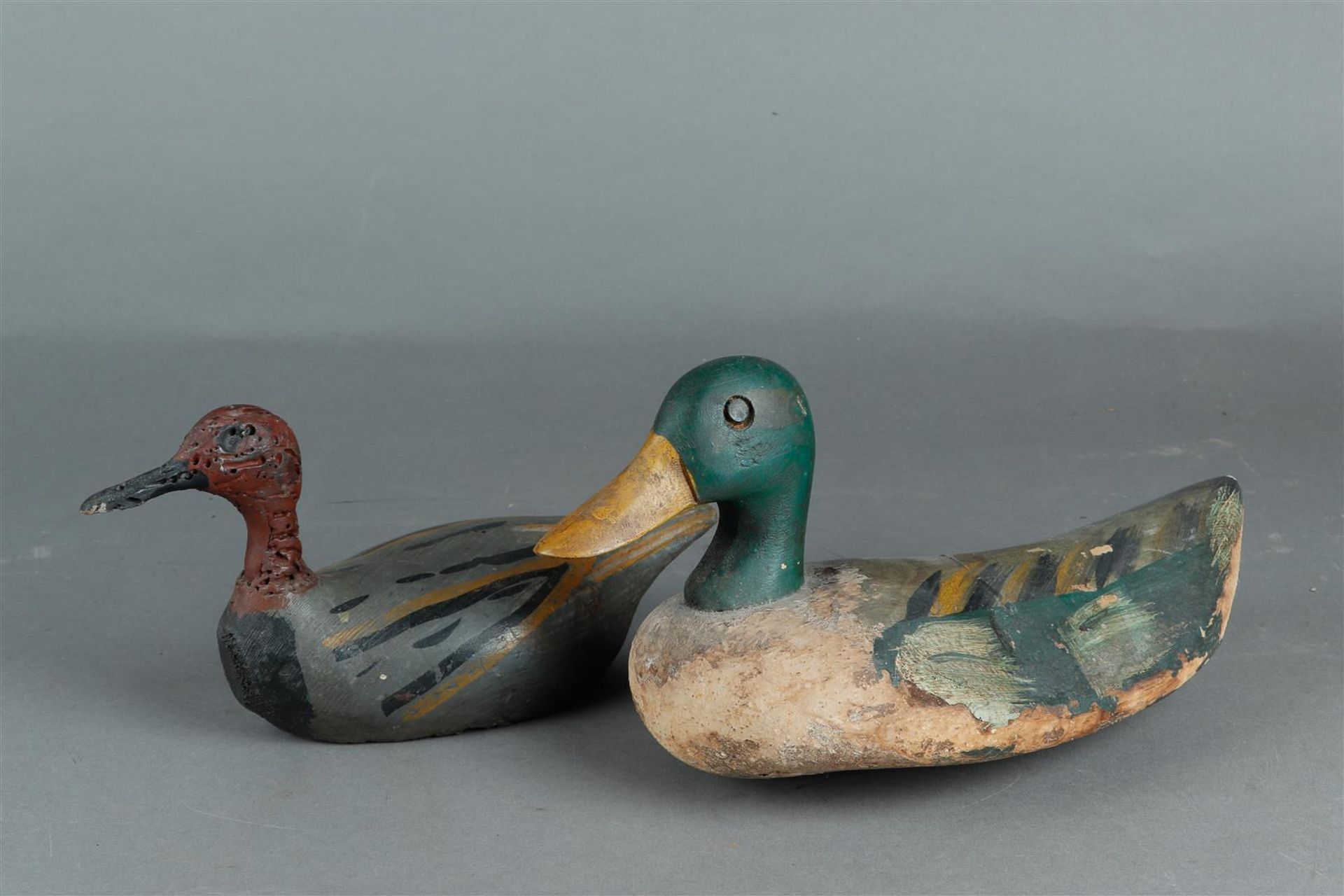 A lot consisting of (2) antique decoys.