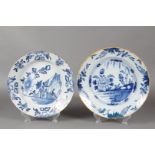 A lot of two floral painted earthenware dishes. Delft, around 1800.