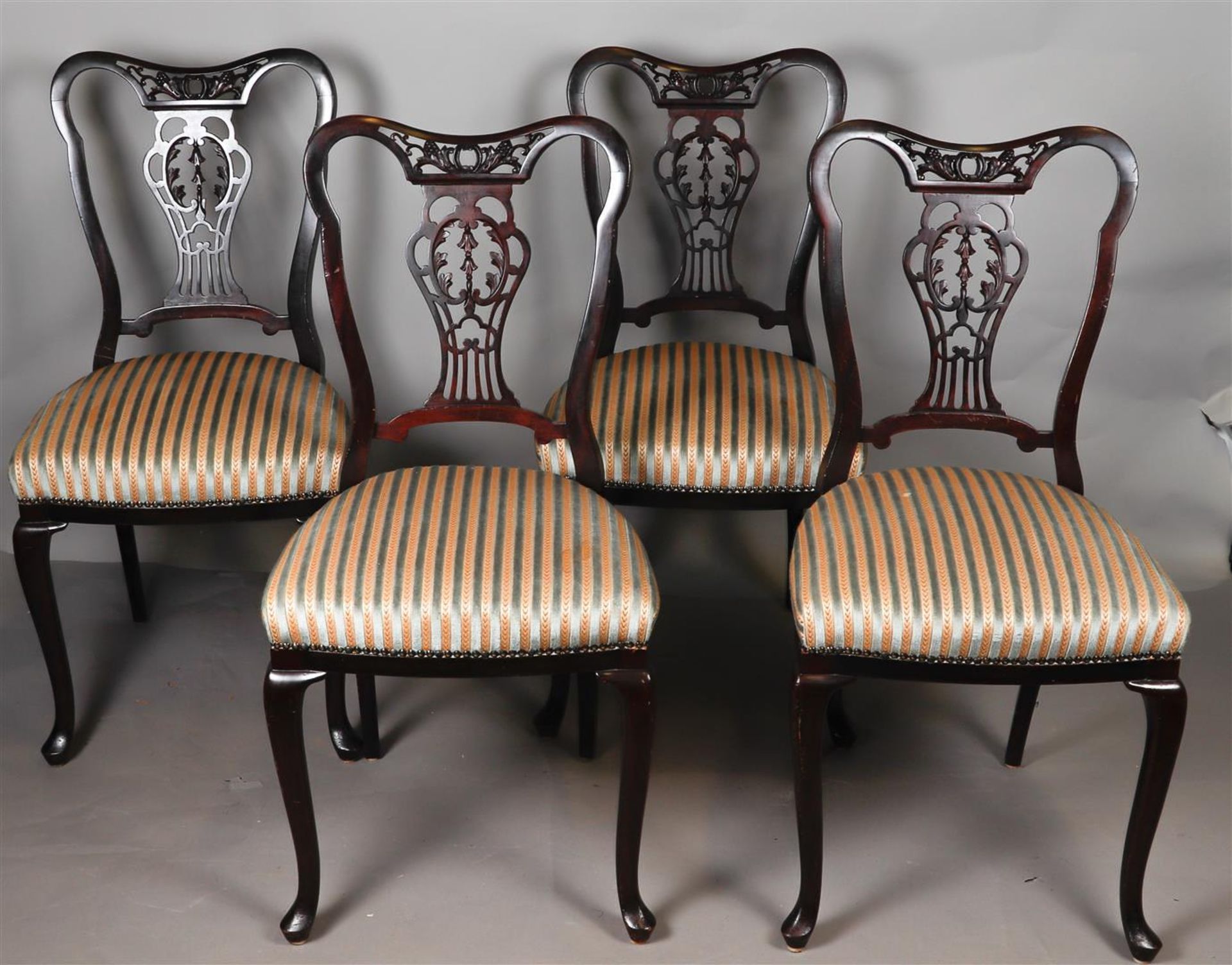 A lot consisting of four chairs with open backs. 19th century.