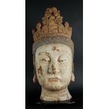 A carved wooden crowned Buddha head. China, Ming?