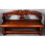 A carved oak hall bench, early 20th century.