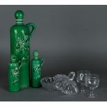 A Lucas Bols liqueur set consisting of (3) earthenware bottles and (2) glasses. In addition, a press