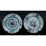 Two porcelain Famille Verte plates; one with floral decor, the other with scroll decor with a river