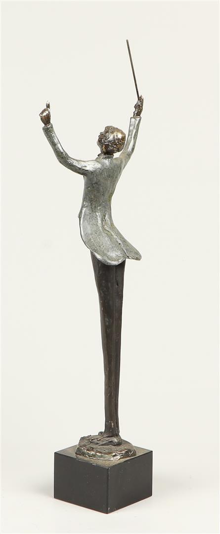 A 20th century bronze statuette of a conductor. - Image 4 of 4