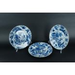 Three porcelain plates with lotus flower and chrysanthemum on rock decor, with seal mark on the back