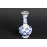 A porcelain belly vase with a slender high neck with floral decor on rock. China, Kangxi.