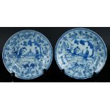 Two porcelain plates with tulip outer rim with floral decor and butterflies. Long lines in the cente