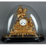 A gold-painted zamac mantel clock decorated with a knight on horseback, in a glass dome. France, 19t