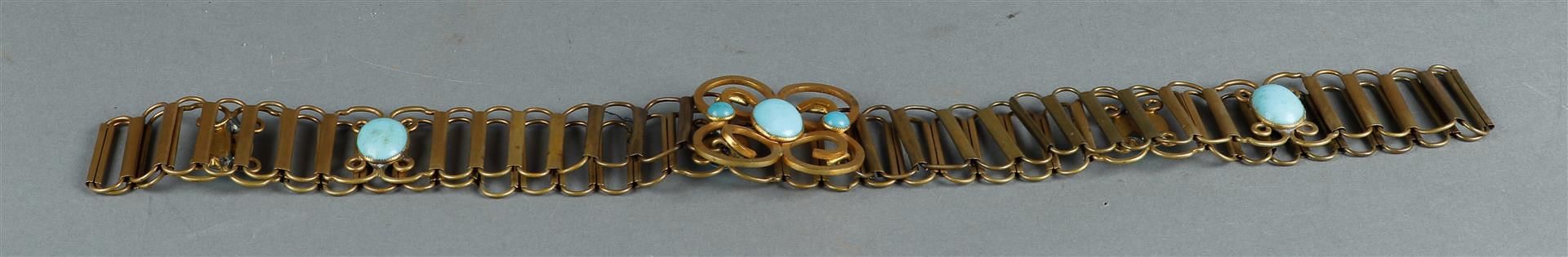 A gold-plated brass belt with buckle, set with large topaz stones. Russian, 19th/20th century.