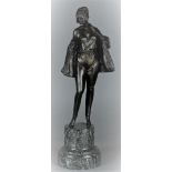 A bronze sculpture depicting a woman undressing mounted on a green marble base.