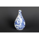 A porcelain belly vase with rich flower-on-rock decor on the front and back. China, Kangxi.