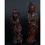 A lot of two wooden sculptures depicting a Guan-Yin and a sage. China, 20th century.