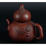 A Yixing teapot with fruit-shaped lid. China, 20th century.