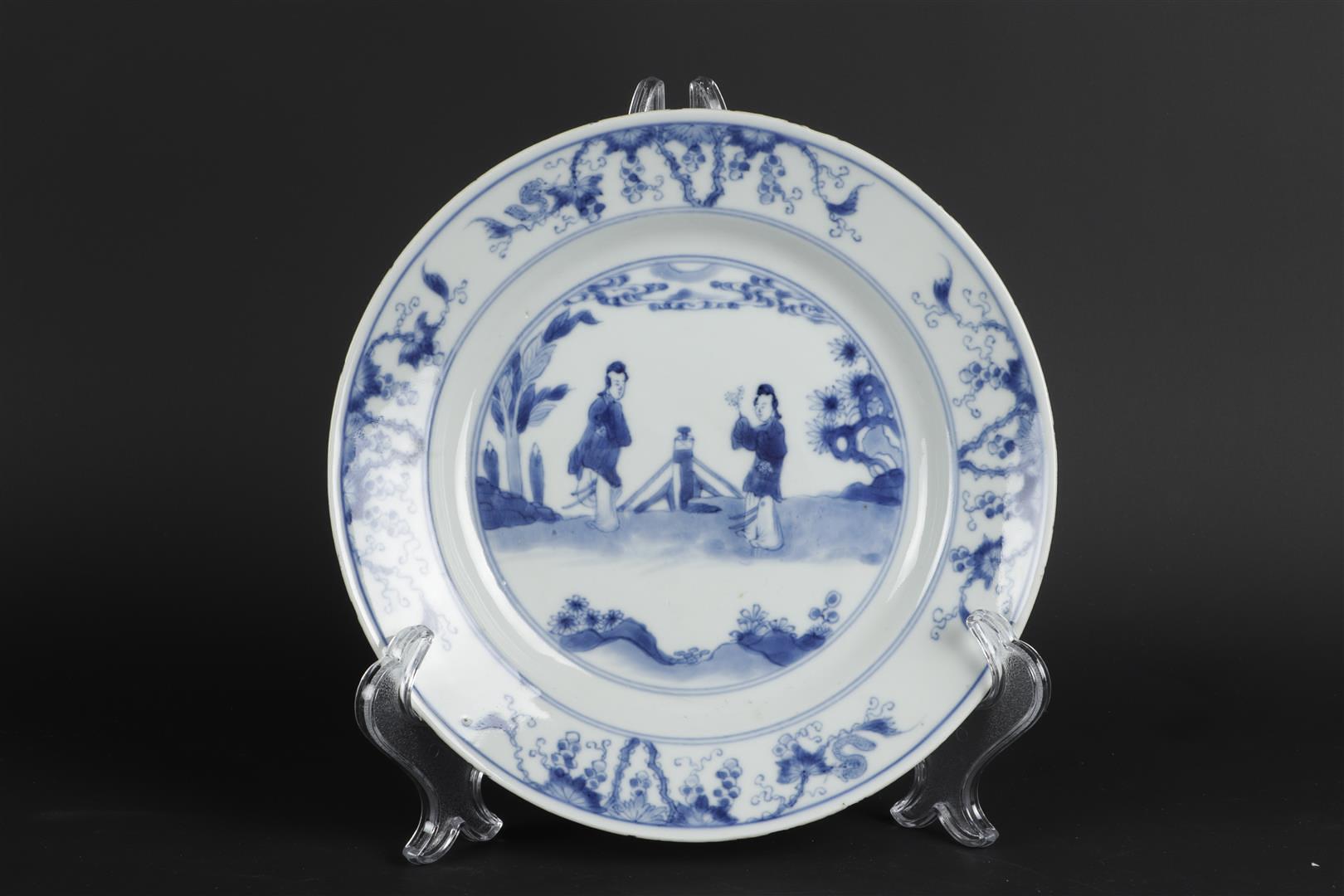 A porcelain plate with decoration in the center of two standing long lines in landscape with fence d - Image 2 of 3