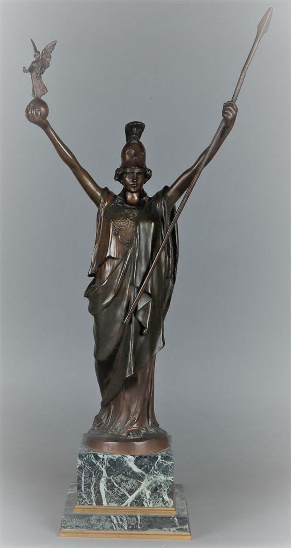 After Hans Müller (Vienna 1873 - 1937), A bronze sculpture of Athena, Nike, Goddess of victory, hold