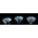 Three porcelain bowls with a dancing figure with a seated figure in the pavilion. China, Yongzheng.