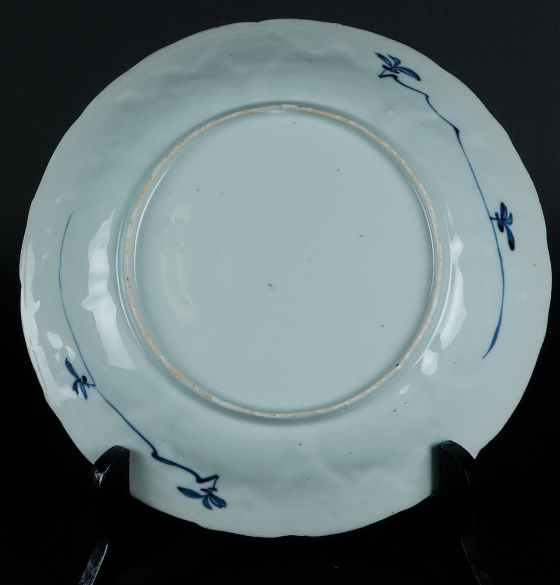 A porcelain plate with a tulip outer rim with floral decor and butterflies. The center with two long - Image 2 of 2
