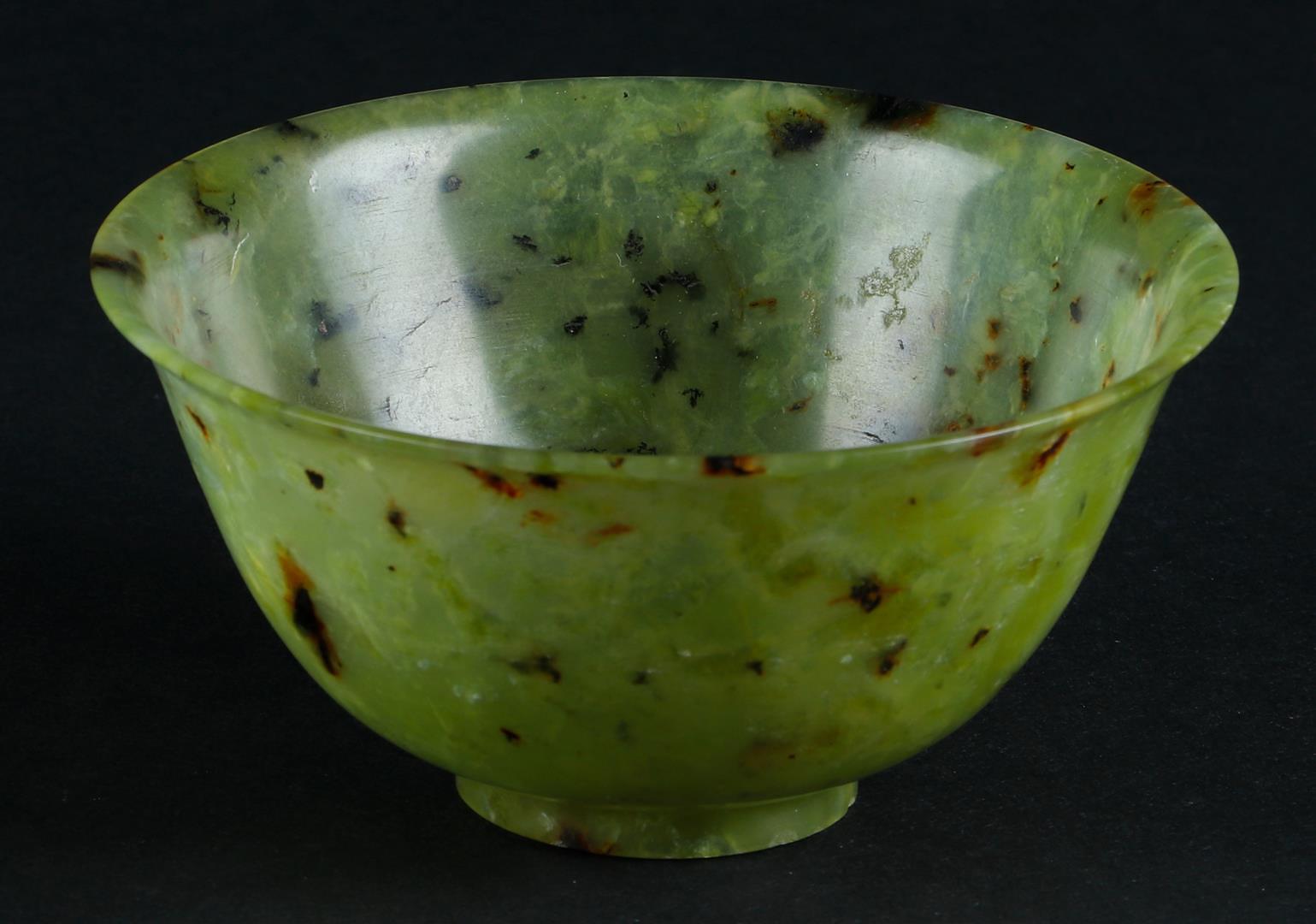 A Celadon Jade bowl with speckled decor. China, 19th/20th century.