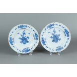 Two Delft earthenware plates with floral decor. 18th century.