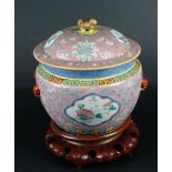 A porcelain Famille Rose lid terinne on a wooden stand. China, 19th/20th century.