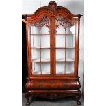 A walnut glued Louis Quinze display cabinet. The curb with two doors with rod division, the lower ca