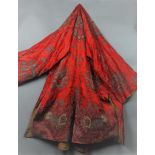 A 19th century embroidered silk cloak, decorated with dragons and Chinese characters.