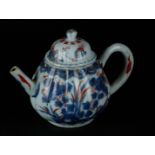 A porcelain Imari ribbed teapot and two Imari cup vases. China, Qianlong.