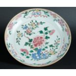 A porcelain Famille Rose dish with flowering branch decor. China, 18th century.