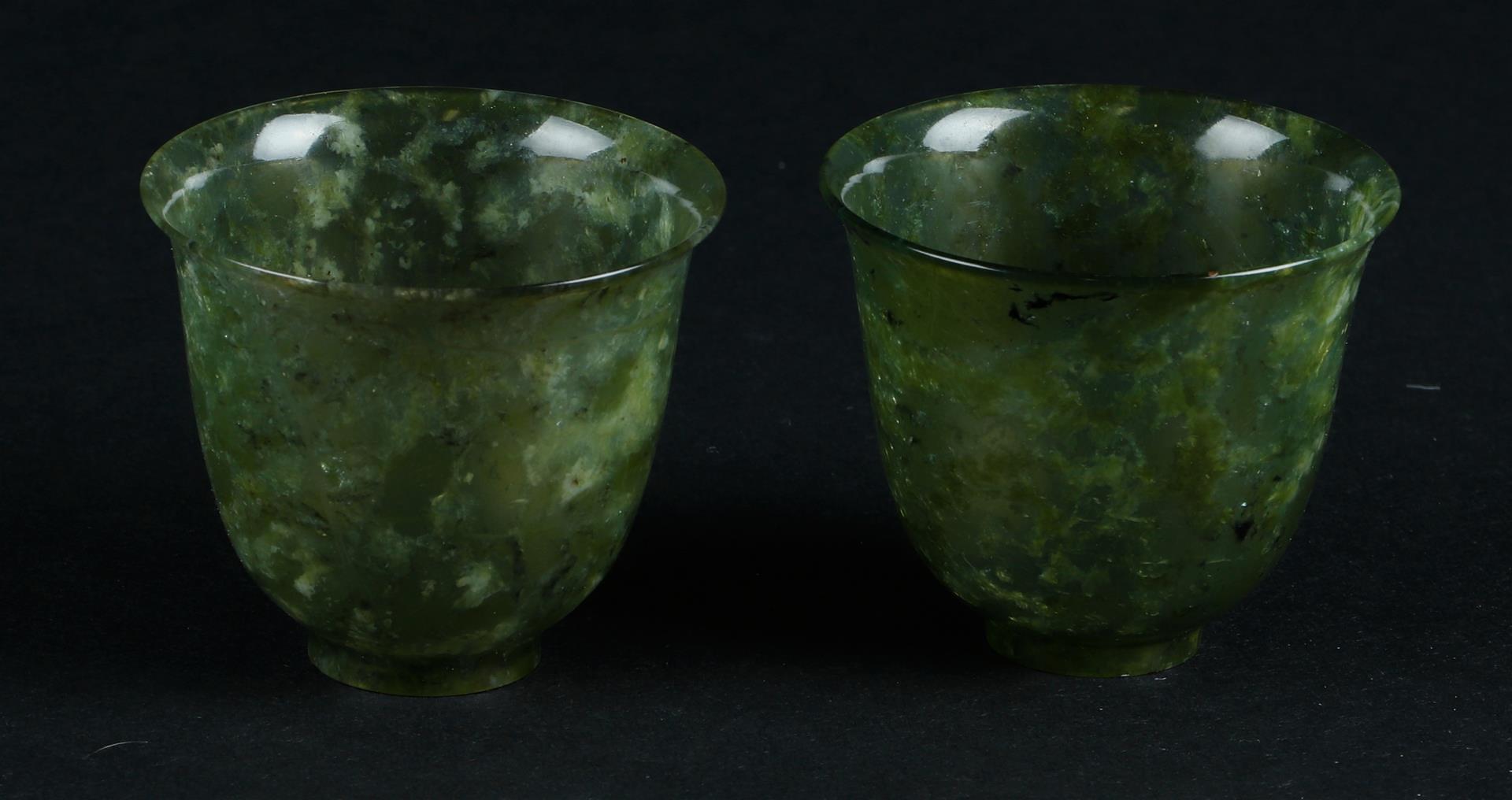 Two Celadon Jade bowls on base ring. China, 19th/20th century.