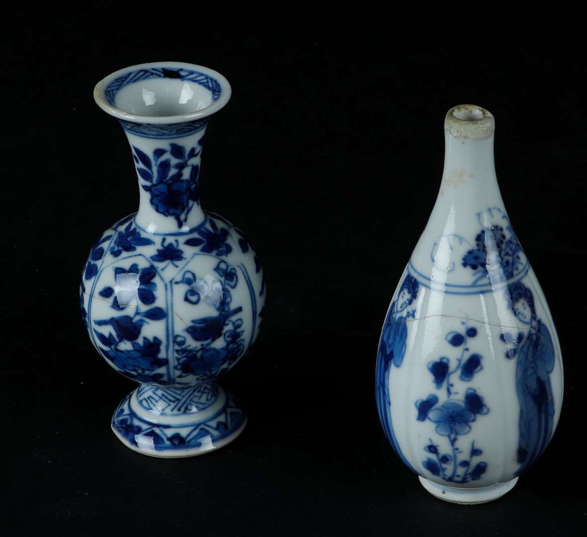 A porcelain ribbed vase with lily decoration on the belly & a belly vase with floral decor in lotus 