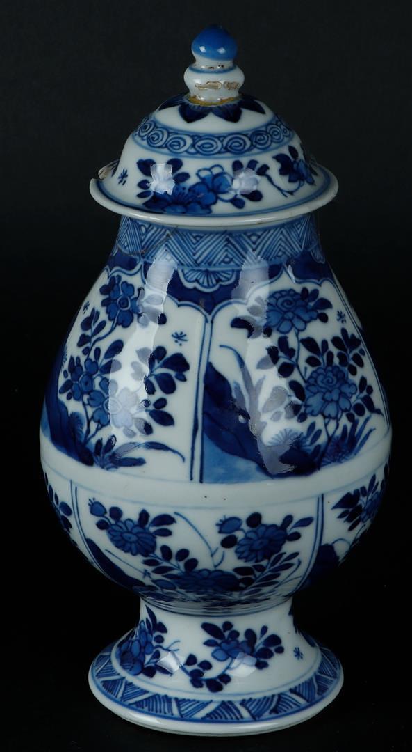 A porcelain belly vase with divisions with rich floral decoration on rock, on a flared foot. China, 