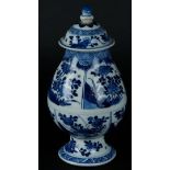 A porcelain belly vase with divisions with rich floral decoration on rock, on a flared foot. China, 