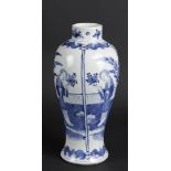 A porcelain vase decorated with various figures in divisions, marked Kangxi. China, 19th century.