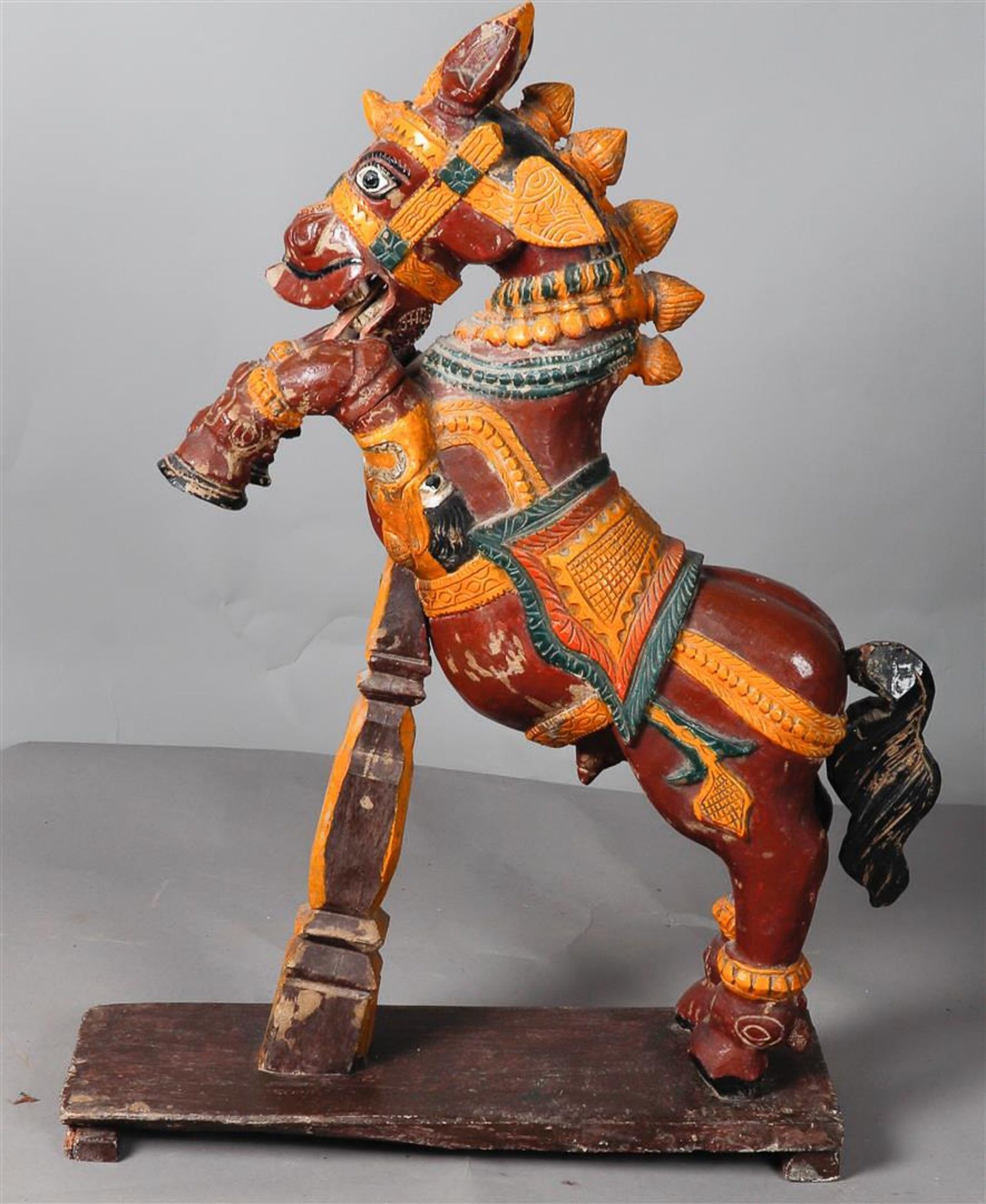 A polychrome carving depicting a rearing horse, India.