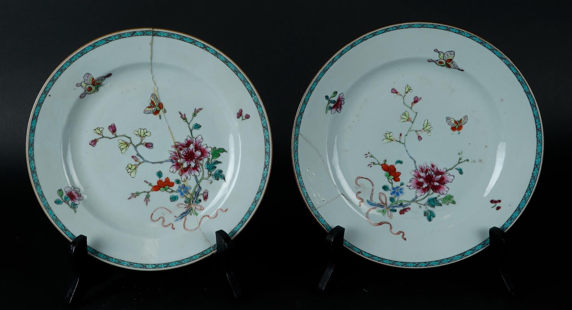 Two porcelain Famille Rose plates with floral decor with butterflies. China, Yongzheng.