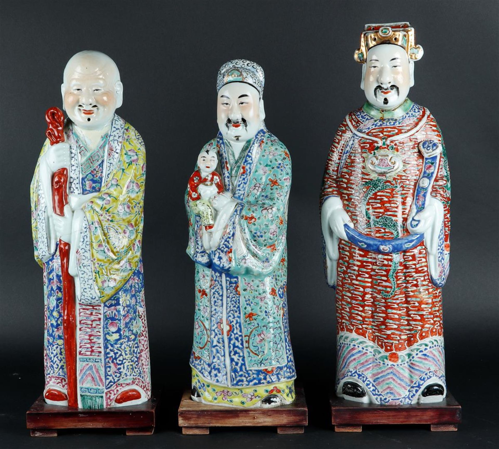 A lot of three porcelain Famille Rose immortals. China, late 19th century.