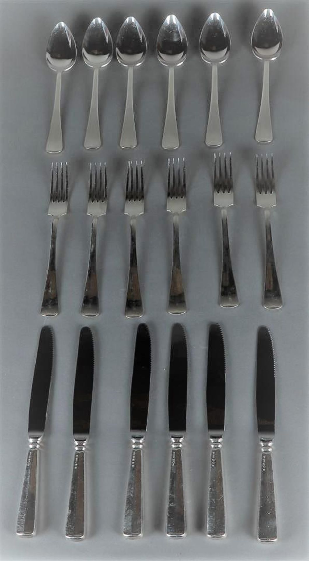 A 6 person silver dinner cutlery set consisting of spoons, knives and forks. 999 silver - M.J. Gerri